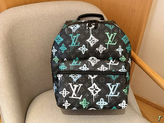 Louis Vuitton Discovery Backpack- Black canvas with green graffiti-style LV logo